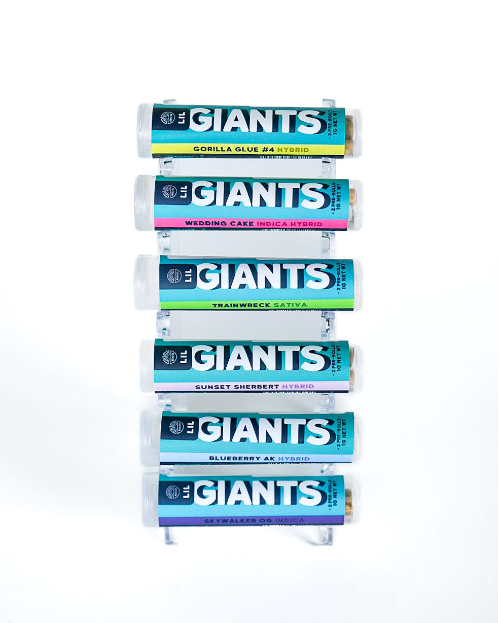 Realize Lil Giants THCA hemp pre-roll tubes display featuring multiple strains including Gorilla Glue, Wedding Cake, Trainwreck, and Blueberry AK